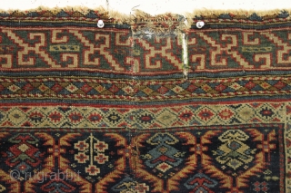 Early east caucasian rug in distressed condition. Lovely green border and a nicely drawn colorful lattice with a large variety of delicate inset elements. Rug is cut and crudely resewn lenghtwise. A  ...