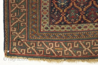 Early east caucasian rug in distressed condition. Lovely green border and a nicely drawn colorful lattice with a large variety of delicate inset elements. Rug is cut and crudely resewn lenghtwise. A  ...