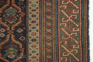Early east caucasian rug in distressed condition. Lovely green border and a nicely drawn colorful lattice with a large variety of delicate inset elements. Rug is cut and crudely resewn lenghtwise. A  ...