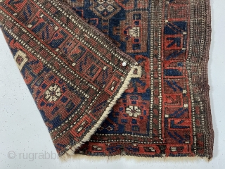 Antique Baluch bagface. Interesting Mina Hani variant. Good natural colors with fine ember reds. Areas of heavy wear as shown. Original selvages. As found, very dirty. 19th c. 24” x 26”  