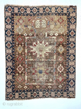 Early Caucasian prayer rug. Kuba?Uncommon design featuring rare combination of lesghi stars, rounded “head” mihrab, large “snowflakes”, hands and nicely drawn “Kufic” border. Complete but overall thin with very low pile and  ...