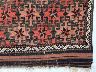 Antique small Baluch rug with very good design, excellent color and overall fair condition for the age. The array of archaic radiating medallions in diagonal bands on a lightly oxidized brown ground  ...