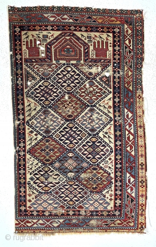  Antique ivory ground Caucasian prayer rug. Probably shirvan with some interesting features including many animals and a well drawn mihrab with hands (although only 4 fingers?). Overall even low pile with  ...