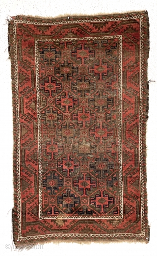 Antique little Baluch with classic tile design field. Interesting meandering vine border. All natural colors. Overall low pile with wear and brown oxidation as shown. Remnant original selvages and kelim ends. I  ...