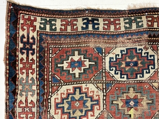 Early colorful moghan Kazak rug with classic memling gul field and nearly square size. Somewhat unusual and spacious ivory border. All good natural colors. As found, scattered areas of wear and a  ...