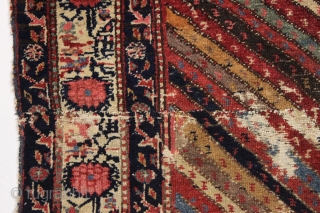 Large fragment of both ends of a beautiful old northwest Persian rug. Interesting design and all natural colors featuring a lovely old purple. Reasonably clean. ca. 1875. 4'4" x 5'10"   