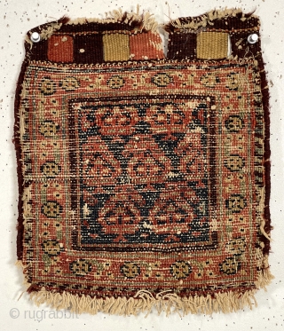 Antique tiny pile bagface, probably northwest Persian, with simple boteh design field and floral meander border. Overall fair pile with a few scattered old small moth nibbles as shown. Original closure tabs.  ...