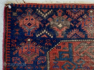 Antique Baluch octagon bagface with interesting archaic drawing but very rough condition. Good saturated natural colors including rich reds and multiple blues. Very low pile with heavy brown oxidation. Thin cloth like  ...