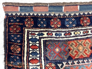 Antique Kurdish bagface with an uncommon design and ridiculous thick lustrous pile. All good natural colors including excellent yellow highlights and rich old purples. Fairly coarse weave and very floppy handle. Characteristic  ...