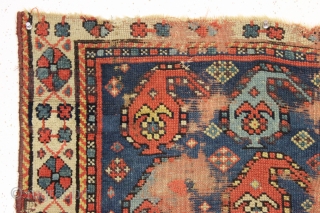 Antique little caucasian rug with an unusual border, unfortunately, ravaged by wolves. Interesting older piece, probably kazak. All natural colors featuring an unusually nice yellow. "as found". 3rd quarter 19th c. 2'8"  ...