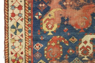 Antique little caucasian rug with an unusual border, unfortunately, ravaged by wolves. Interesting older piece, probably kazak. All natural colors featuring an unusually nice yellow. "as found". 3rd quarter 19th c. 2'8"  ...