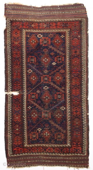 antique early baluch rug. Rare example just found locally. "as found", complete with original kelim ends but very dirty with wear and a good tear as shown. All natural colors. 3rd qtr.  ...