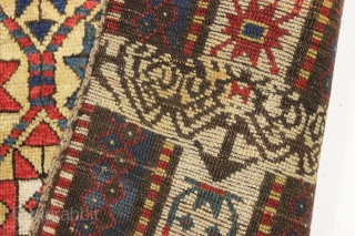 large yellow ground antique kazak or karrabaugh rug with a most unusual design feature. An inexplicable ivory panel woven into the rug as shown. When I first saw the rug I was  ...