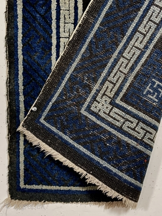 Older Chinese small Baotou rug with interesting dragon design. Look closely and you can see two dragons facing each other. Overall good condition for the age. Indigo pile quite high and black/brown  ...