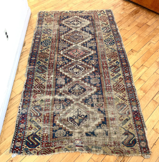 Caucasian long rug with eye catching wide yellow “S” border. Good natural colors. All wool. Not perfect condition with some heavy wear and edge roughness. Attractive older example. ca. 1875 or earrlier.  ...