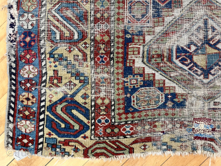 Caucasian long rug with eye catching wide yellow “S” border. Good natural colors. All wool. Not perfect condition with some heavy wear and edge roughness. Attractive older example. ca. 1875 or earrlier.  ...