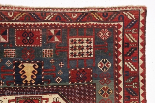antique karachopf kazak. Untouched, unrestored large classic kazak. All natural colors featuring a beauiful abrashed green field, good reds, multiple blues and a fine old yellow. Pile varies from good thick medium  ...