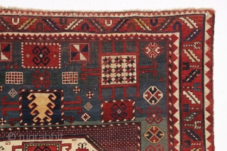 antique karachopf kazak. Untouched, unrestored large classic kazak. All natural colors featuring a beauiful abrashed green field, good reds, multiple blues and a fine old yellow. Pile varies from good thick medium  ...