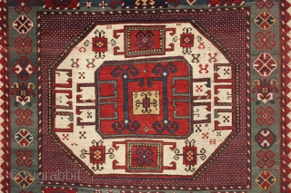 antique karachopf kazak. Untouched, unrestored large classic kazak. All natural colors featuring a beauiful abrashed green field, good reds, multiple blues and a fine old yellow. Pile varies from good thick medium  ...