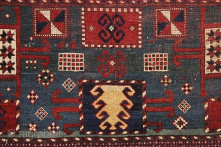 antique karachopf kazak. Untouched, unrestored large classic kazak. All natural colors featuring a beauiful abrashed green field, good reds, multiple blues and a fine old yellow. Pile varies from good thick medium  ...