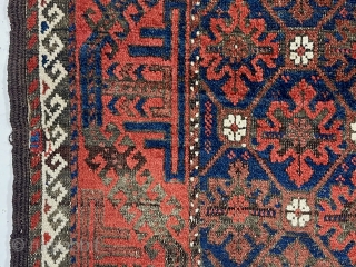 Antique small Baluch rug with a “snowflake” type design and turkman “boat” border. Very good natural color featuring a rich ember red ample white highlights and a deep blue ground. Overall decent  ...