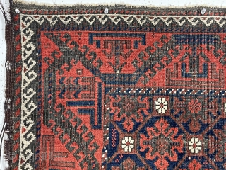 Antique small Baluch rug with a “snowflake” type design and turkman “boat” border. Very good natural color featuring a rich ember red ample white highlights and a deep blue ground. Overall decent  ...