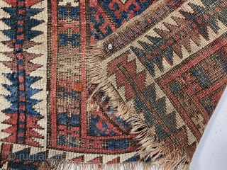 Antique jaf Kurd bagface with some interesting features but in very rough condition. This older example has a somewhat larger scale field and both uncommon main and minor borders. The diamond lattice  ...