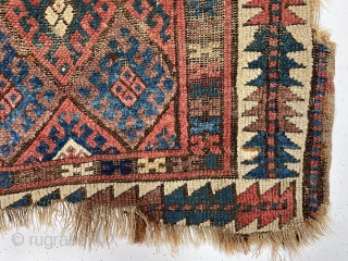 Antique jaf Kurd bagface with some interesting features but in very rough condition. This older example has a somewhat larger scale field and both uncommon main and minor borders. The diamond lattice  ...