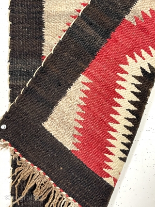 Older little Navajo weaving. Saddle blanket? Pretty natural wool colors and a rich saturated red. No color run. Fair condition for age. I see a couple small dime sized holes in border.  ...