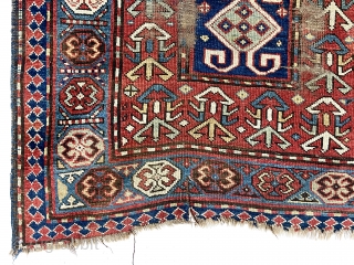 Antique Caucasian Kazak or karrabagh rug with an interesting and archaic design. Pretty light blue border. Some decent pile but essentially ravaged by wolves condition. Wear, tears, stains, black oxidation, edge gouges  ...