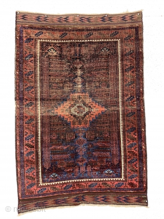 Early blue ground timuri Baluch rug with vivid electric blues. Unusual field design with archaic floral motifs and a beautifully drawn central medallion. All natural colors. Thin and floppy with very fine  ...