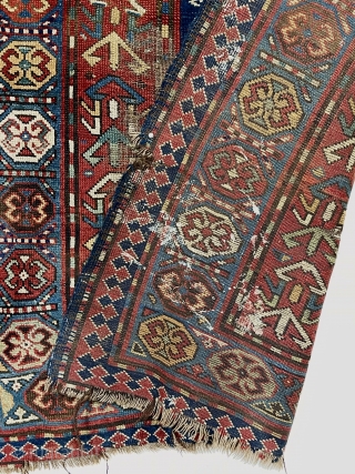 Antique Caucasian Kazak or karrabagh rug with an interesting and archaic design. Pretty light blue border. Some decent pile but essentially ravaged by wolves condition. Wear, tears, stains, black oxidation, edge gouges  ...