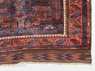 Early blue ground timuri Baluch rug with vivid electric blues. Unusual field design with archaic floral motifs and a beautifully drawn central medallion. All natural colors. Thin and floppy with very fine  ...