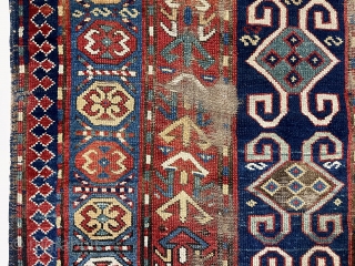 Antique Caucasian Kazak or karrabagh rug with an interesting and archaic design. Pretty light blue border. Some decent pile but essentially ravaged by wolves condition. Wear, tears, stains, black oxidation, edge gouges  ...