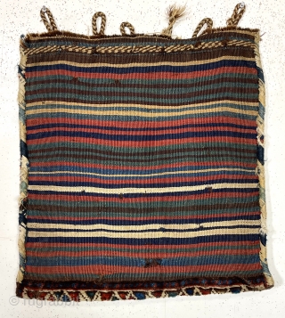 Antique complete south Persian bag. Mostly good thick high pile. All natural colors. Original fancy closure tabs and colorful back. Reasonably clean. Nice example of the type. Late 19th c. About 24”  ...