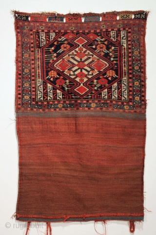 Antique South Persian complete bag. Classic design. All good natural colors. No repairs. Even low pile. Original closure tabs.  ca. 1880 weaving  28" x 44" open flat
    