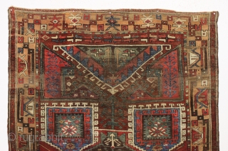 Early turkish village rug. Archaic. Beautiful natural colors. Old piece with scattered small repairs of varying quality. First half 19th c. 5'1" x 7'3"         