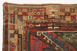 Early turkish village rug. Archaic. Beautiful natural colors. Old piece with scattered small repairs of varying quality. First half 19th c. 5'1" x 7'3"         