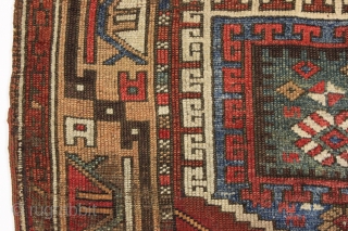 Early turkish village rug. Archaic. Beautiful natural colors. Old piece with scattered small repairs of varying quality. First half 19th c. 5'1" x 7'3"         