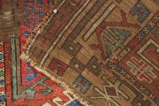 Early turkish village rug. Archaic. Beautiful natural colors. Old piece with scattered small repairs of varying quality. First half 19th c. 5'1" x 7'3"         