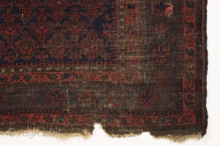 It may look like a black smudge but if you look closely this is an early baluch prayer rug. Blue ground with iconic lattice design and beautiful tree hand panels. All natural  ...