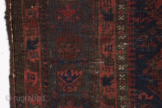 It may look like a black smudge but if you look closely this is an early baluch prayer rug. Blue ground with iconic lattice design and beautiful tree hand panels. All natural  ...