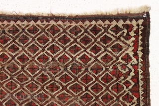 Antique tiny Baluch rug with an unusual allover design. All natural colors. "as found", with some wear as shown but original sides and ends. Reasonably clean with a small old stain as  ...