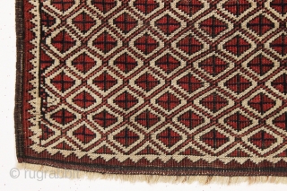 Antique tiny Baluch rug with an unusual allover design. All natural colors. "as found", with some wear as shown but original sides and ends. Reasonably clean with a small old stain as  ...