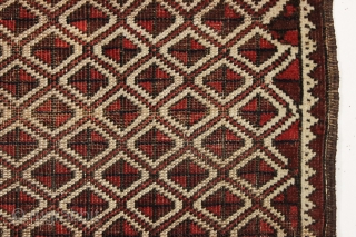 Antique tiny Baluch rug with an unusual allover design. All natural colors. "as found", with some wear as shown but original sides and ends. Reasonably clean with a small old stain as  ...