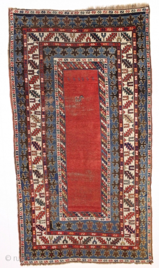 antique large kazak rug with eye catching borders and nearly empty field. All natural colors including a beautiful old purple. Some wear and heavy brown oxidation as shown but mostly decent pile  ...