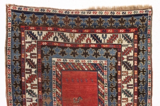 antique large kazak rug with eye catching borders and nearly empty field. All natural colors including a beautiful old purple. Some wear and heavy brown oxidation as shown but mostly decent pile  ...