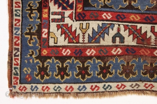 antique large kazak rug with eye catching borders and nearly empty field. All natural colors including a beautiful old purple. Some wear and heavy brown oxidation as shown but mostly decent pile  ...