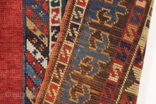 antique large kazak rug with eye catching borders and nearly empty field. All natural colors including a beautiful old purple. Some wear and heavy brown oxidation as shown but mostly decent pile  ...