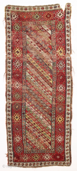 antique caucasian long rug, probably talish. Nice design with good colors featuring rich greens, multiple reds, light blues, and a deep purple. "as found", with wear, heavy black oxidation and some damage  ...